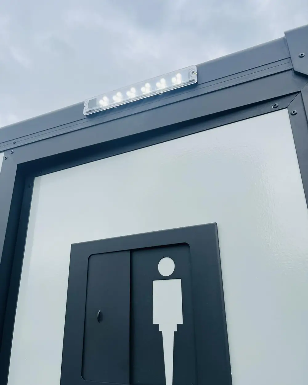 Men's room door sign on a restroom trailer