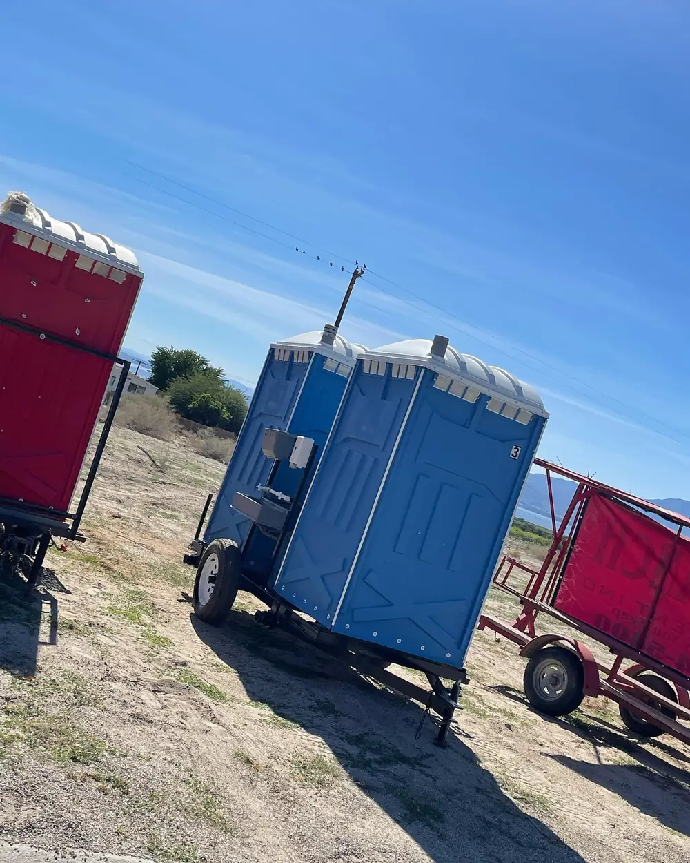Portable toilets placed along a residential curb